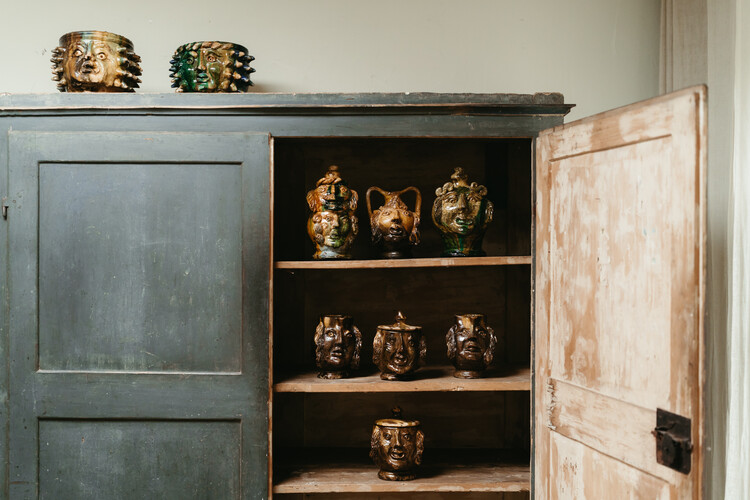 collection of glazed terra cotta grotesque jugs and bowls ...