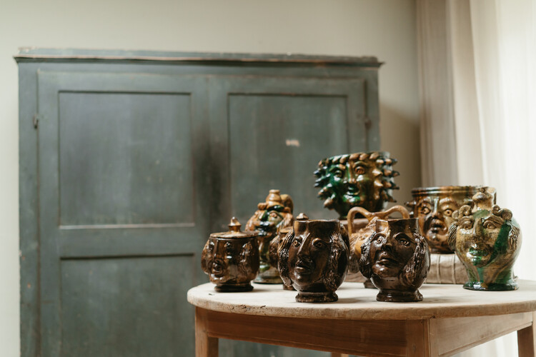 collection of glazed terra cotta grotesque jugs and bowls ...