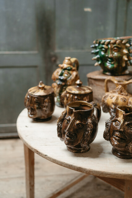 collection of glazed terra cotta grotesque jugs and bowls ...