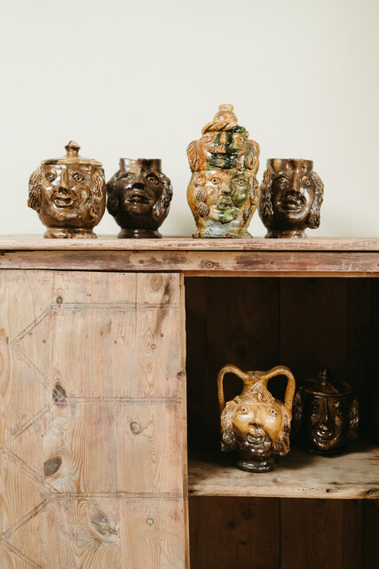 collection of glazed terra cotta grotesque jugs and bowls ...