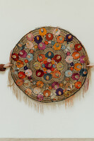 lovely piece of embroidered textile, mounted on an iron circle...