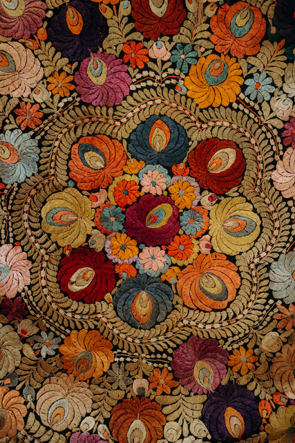 lovely piece of embroidered textile, mounted on an iron circle...