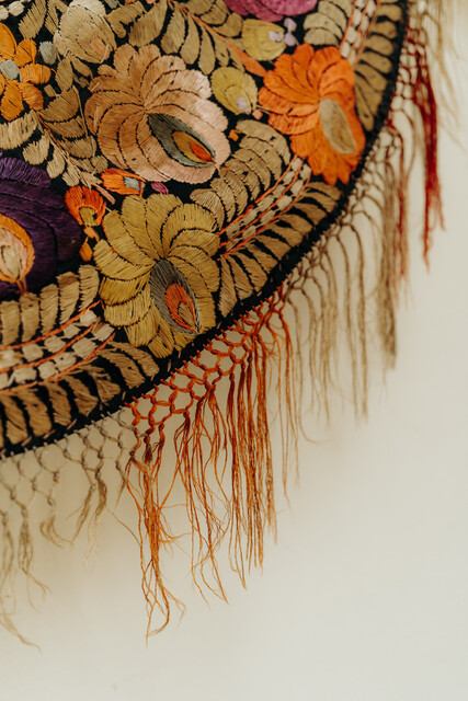 lovely piece of embroidered textile, mounted on an iron circle...