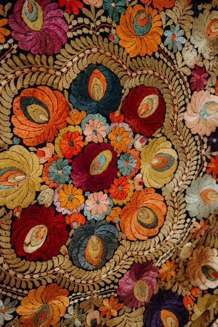 lovely piece of embroidered textile, mounted on an iron circle...